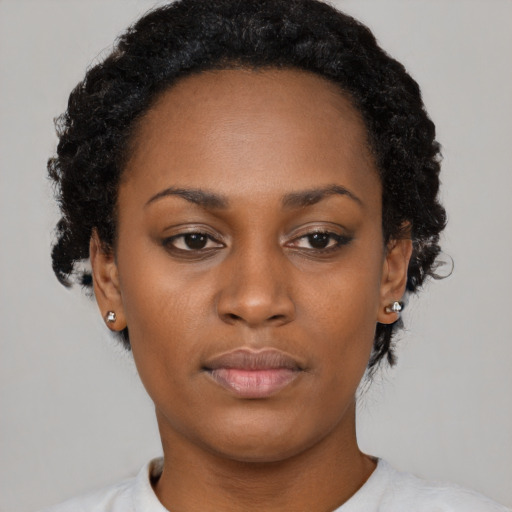Neutral black young-adult female with short  black hair and brown eyes