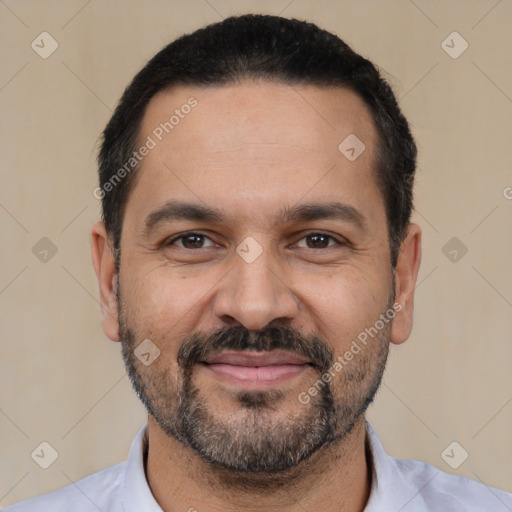 Joyful white adult male with short  black hair and brown eyes