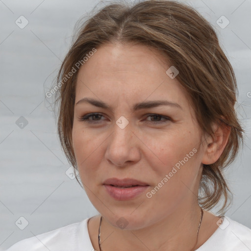 Joyful white adult female with medium  brown hair and brown eyes