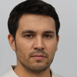 Neutral asian young-adult male with short  brown hair and brown eyes
