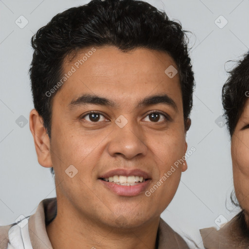 Joyful latino young-adult male with short  brown hair and brown eyes