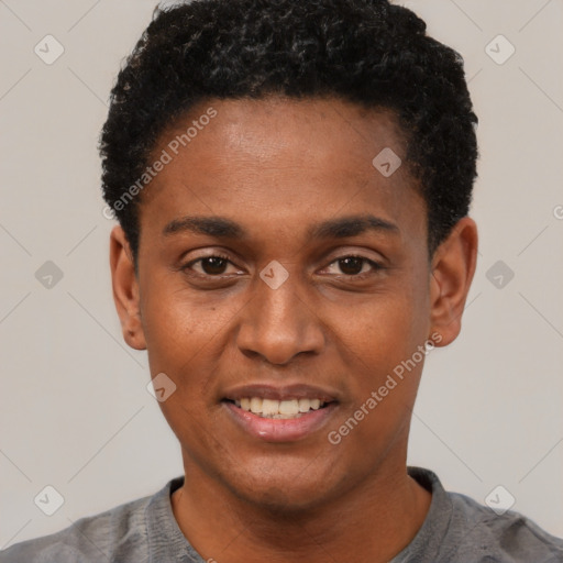 Joyful black young-adult male with short  black hair and brown eyes