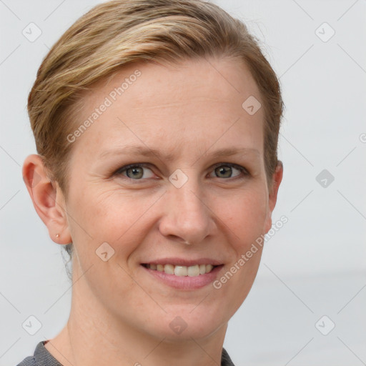 Joyful white adult female with short  brown hair and grey eyes