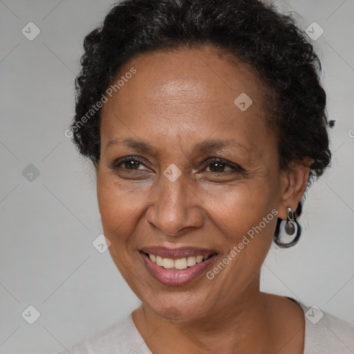 Joyful black adult female with short  brown hair and brown eyes