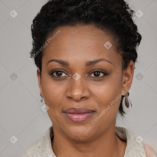 Joyful black adult female with short  brown hair and brown eyes