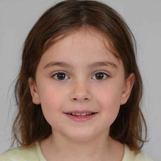 Joyful white child female with medium  brown hair and brown eyes