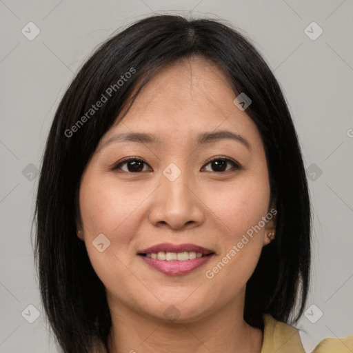 Joyful asian young-adult female with medium  brown hair and brown eyes