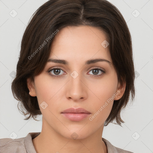 Neutral white young-adult female with medium  brown hair and brown eyes