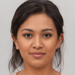 Joyful asian young-adult female with medium  brown hair and brown eyes