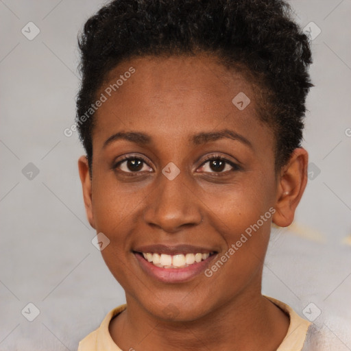 Joyful black young-adult female with short  brown hair and brown eyes