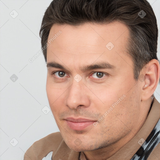 Joyful white adult male with short  brown hair and brown eyes