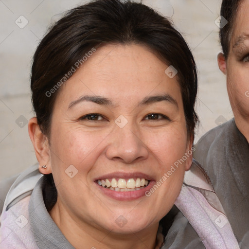 Joyful white adult female with medium  brown hair and brown eyes