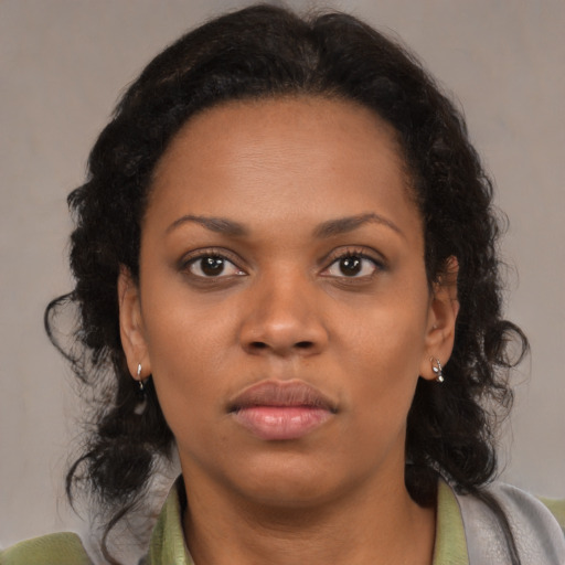 Neutral black young-adult female with medium  brown hair and brown eyes