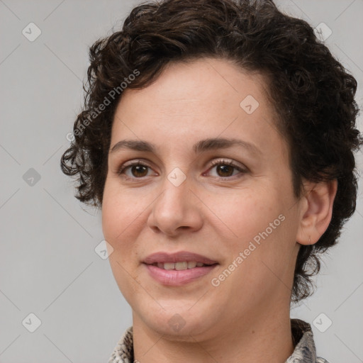 Joyful white adult female with short  brown hair and brown eyes