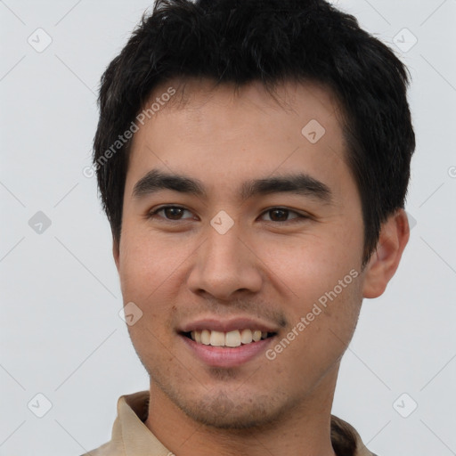 Joyful white young-adult male with short  black hair and brown eyes