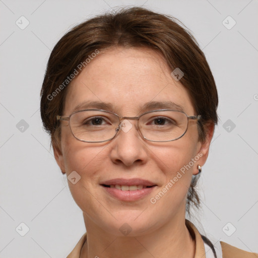 Joyful white adult female with medium  brown hair and grey eyes