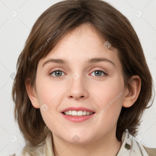 Joyful white young-adult female with medium  brown hair and green eyes