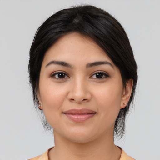 Joyful asian young-adult female with medium  brown hair and brown eyes