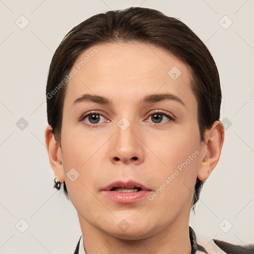 Neutral white young-adult female with short  brown hair and brown eyes