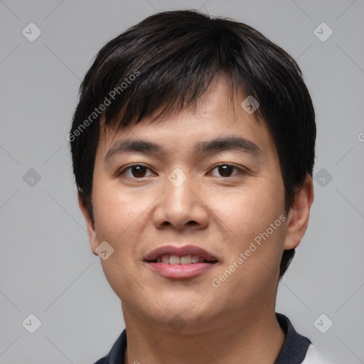 Joyful asian young-adult male with short  black hair and brown eyes