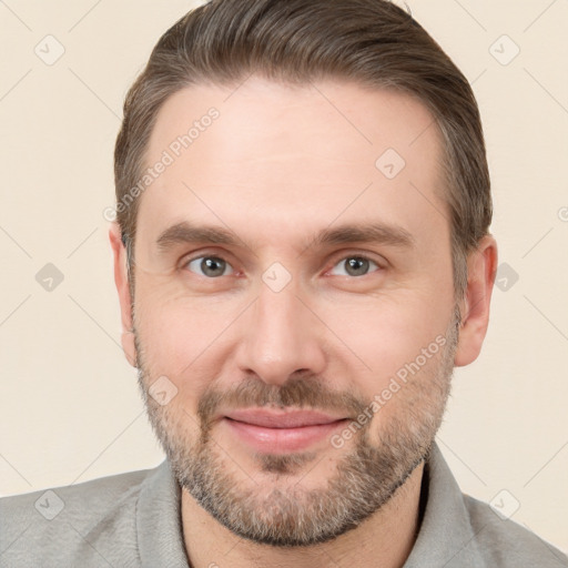 Joyful white adult male with short  brown hair and brown eyes