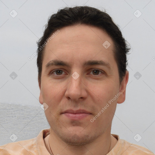 Joyful white adult male with short  brown hair and brown eyes