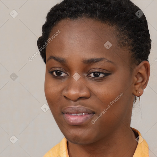 Joyful black young-adult female with short  black hair and brown eyes