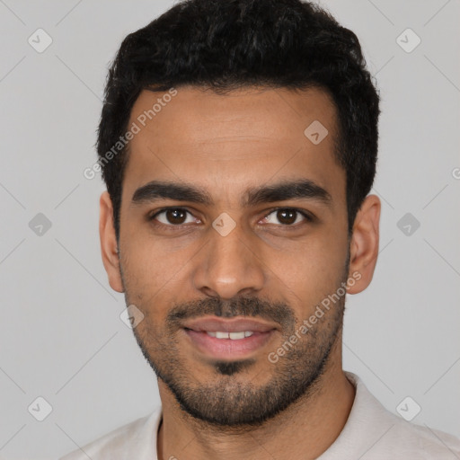 Joyful latino young-adult male with short  black hair and brown eyes