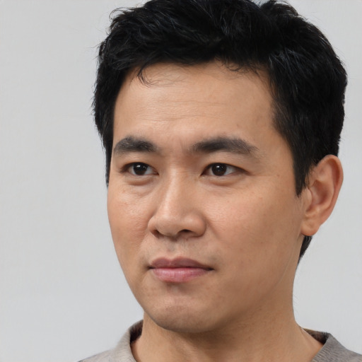 Neutral asian young-adult male with short  black hair and brown eyes