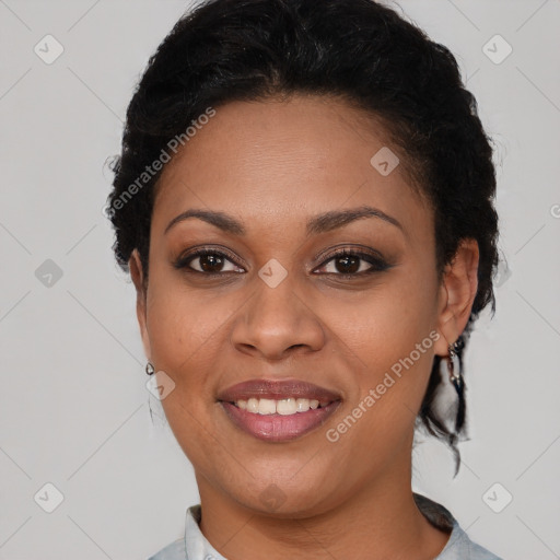 Joyful black adult female with short  brown hair and brown eyes