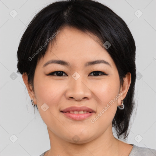 Joyful asian young-adult female with medium  brown hair and brown eyes