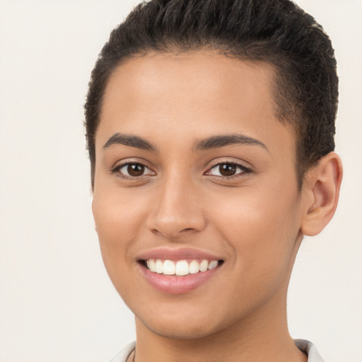 Joyful latino young-adult female with short  brown hair and brown eyes