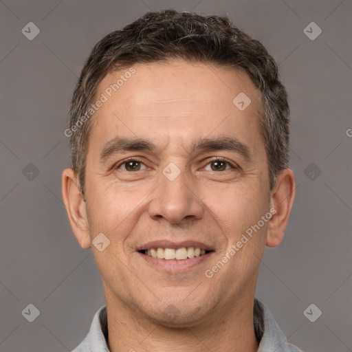 Joyful white adult male with short  brown hair and brown eyes