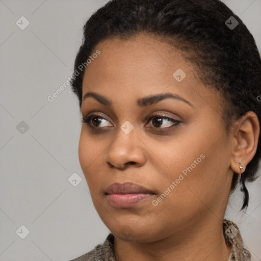 Joyful black young-adult female with short  brown hair and brown eyes