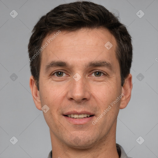 Joyful white adult male with short  brown hair and brown eyes