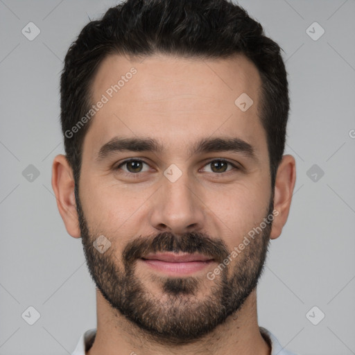 Joyful white young-adult male with short  black hair and brown eyes