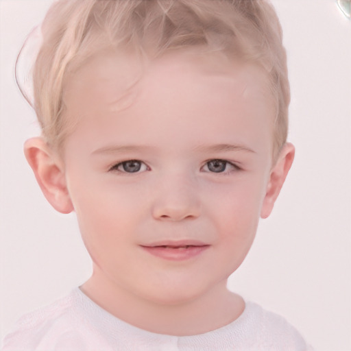 Joyful white child male with short  blond hair and grey eyes