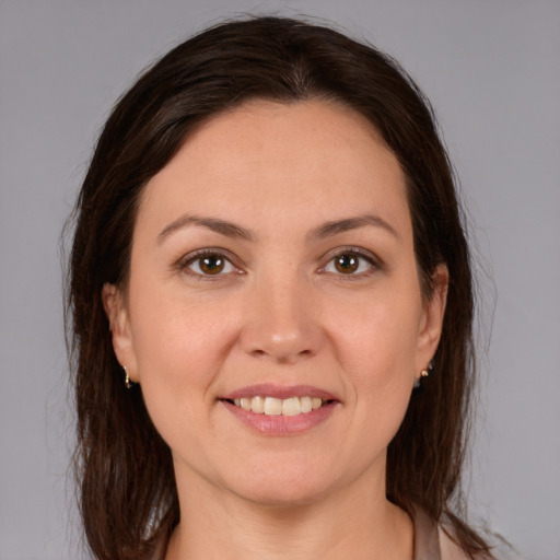 Joyful white young-adult female with medium  brown hair and brown eyes