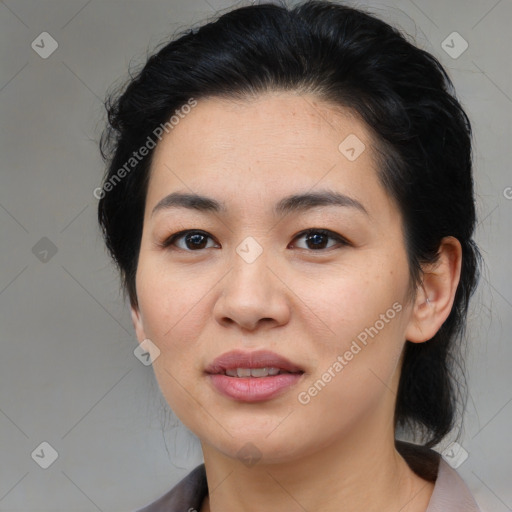 Joyful asian young-adult female with medium  black hair and brown eyes