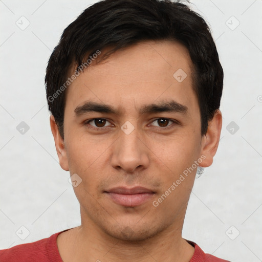 Joyful white young-adult male with short  black hair and brown eyes