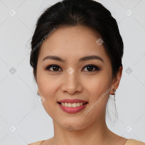 Joyful asian young-adult female with medium  brown hair and brown eyes
