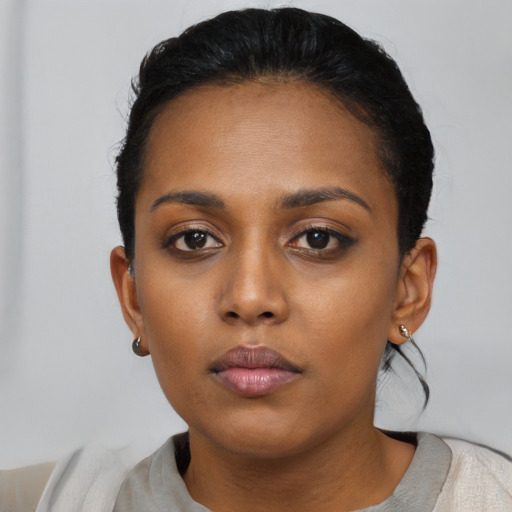 Neutral black young-adult female with short  black hair and brown eyes