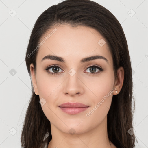 Joyful white young-adult female with long  brown hair and brown eyes