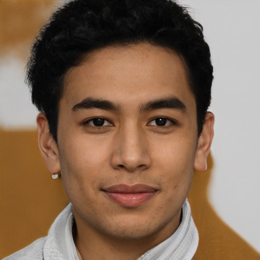 Joyful asian young-adult male with short  black hair and brown eyes