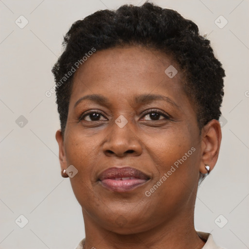 Joyful black adult female with short  brown hair and brown eyes