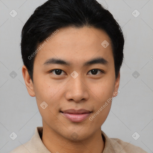 Joyful asian young-adult male with short  black hair and brown eyes