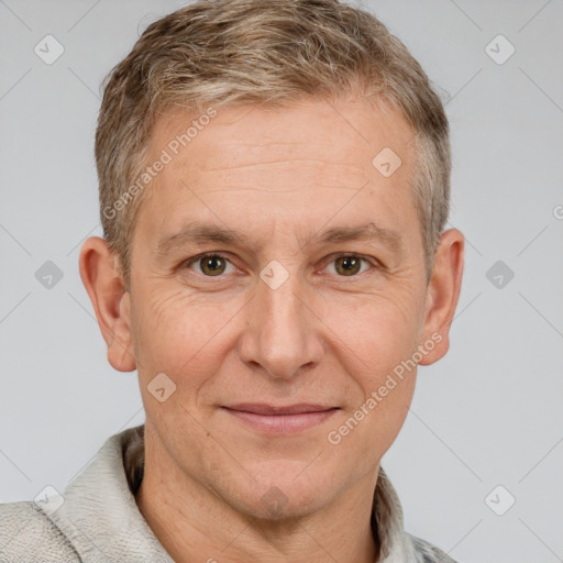 Joyful white adult male with short  brown hair and grey eyes