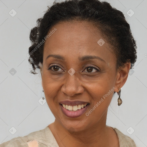 Joyful black adult female with short  brown hair and brown eyes