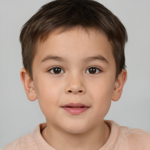 Joyful white child male with short  brown hair and brown eyes