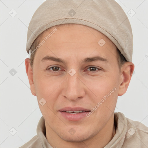 Joyful white adult male with short  brown hair and brown eyes